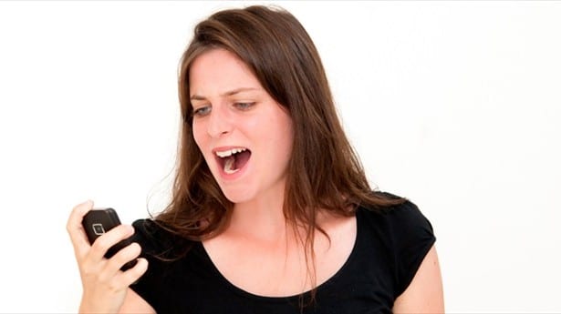 'angry woman making a phone call' via Shutterstock